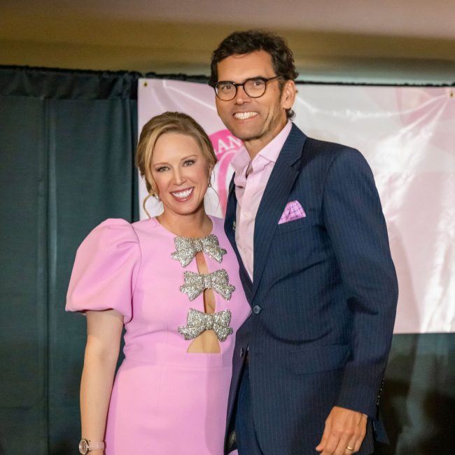 Morgan Pressel and Grant Boone smiling together at a charity event at St. Andrews Country Club in Boca Raton.