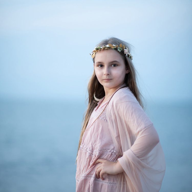 Young girl in a pink dress and flower crown by the sea, Boca Raton photographer